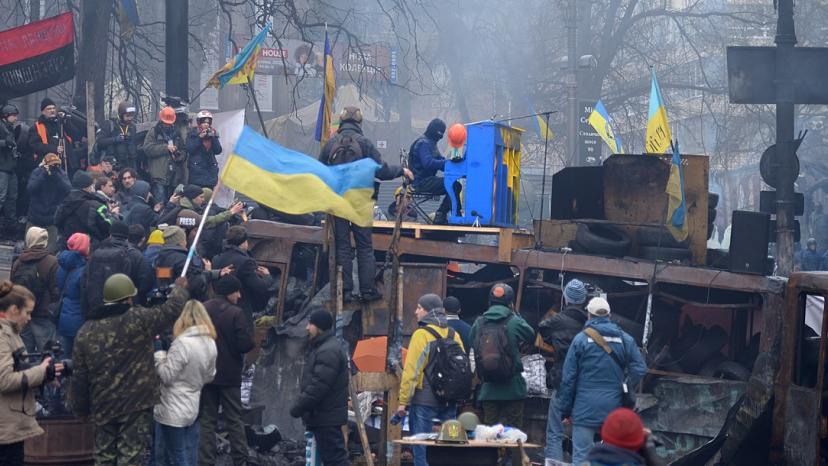 "Piano Extremist" is playing piano on the roof of a burned Berkut bus. The barricade across Hrushevskoho str. Kiev, 10 February 2014.